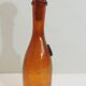 Amber bottle in bubbled blown glass, signed Biot – France, vintage 1970s