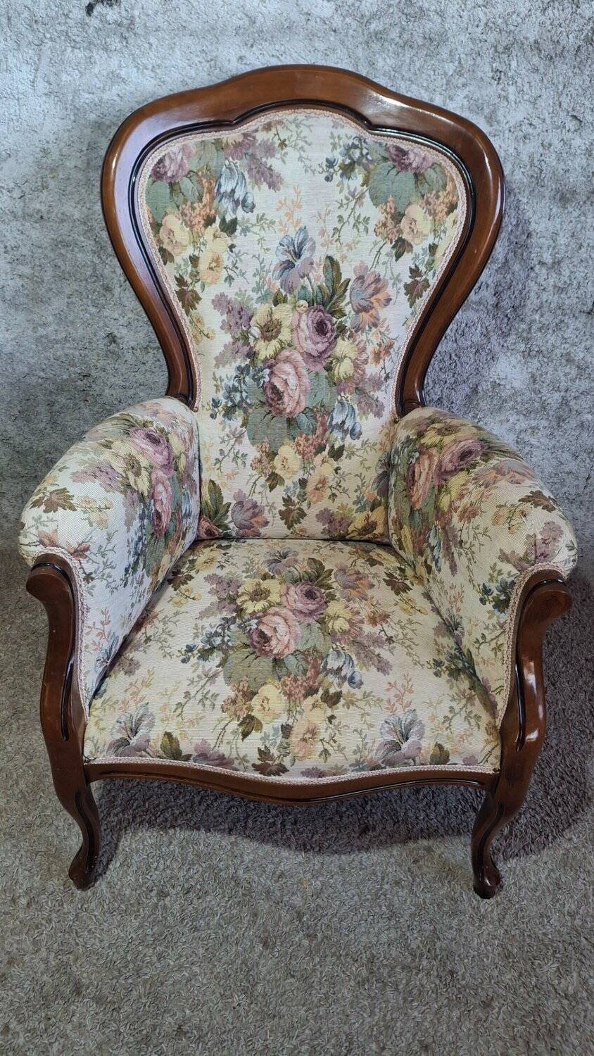 Louis XV style armchair with floral jacquard upholstery.