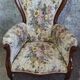 Louis XV style armchair with floral jacquard upholstery.