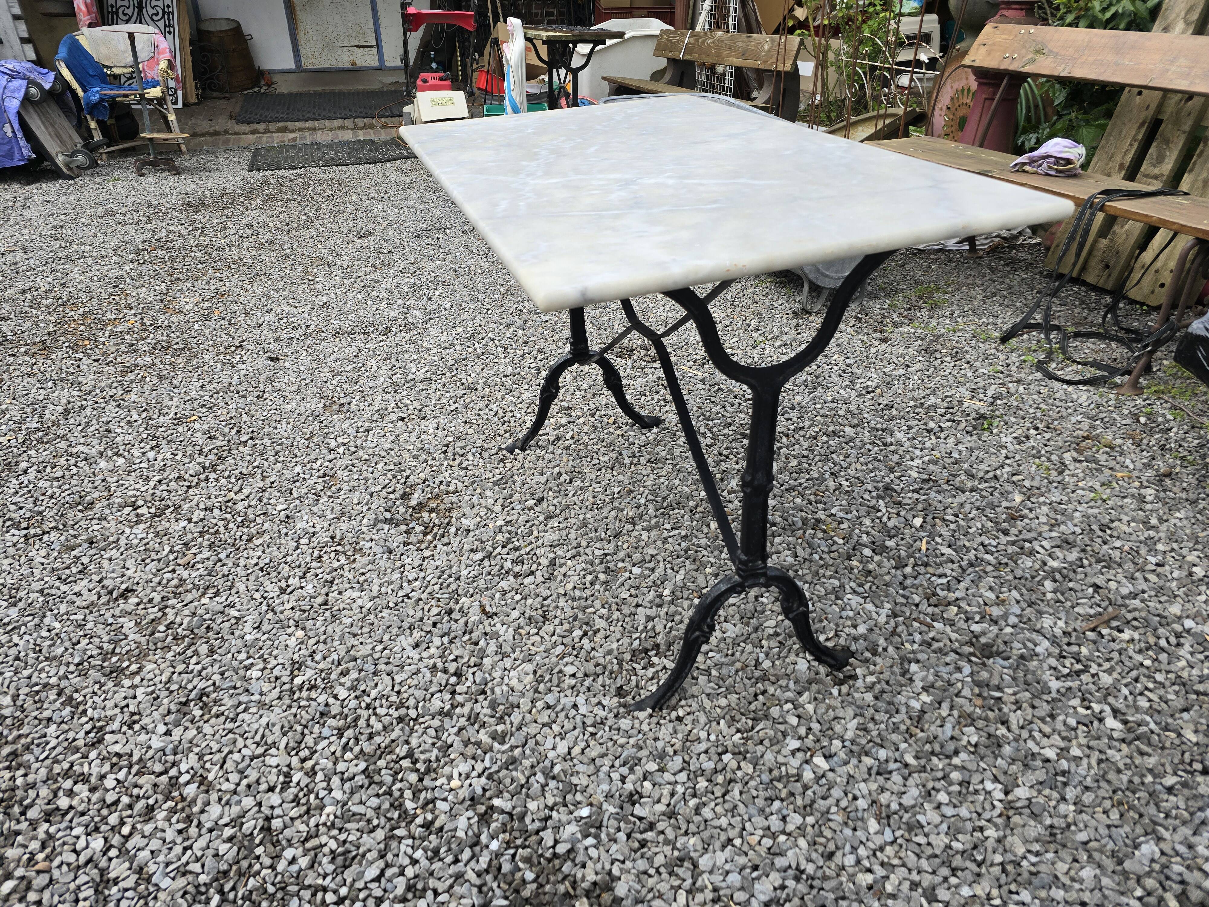 Bistro table with marble top and cast iron base