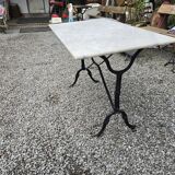 Bistro table with marble top and cast iron base