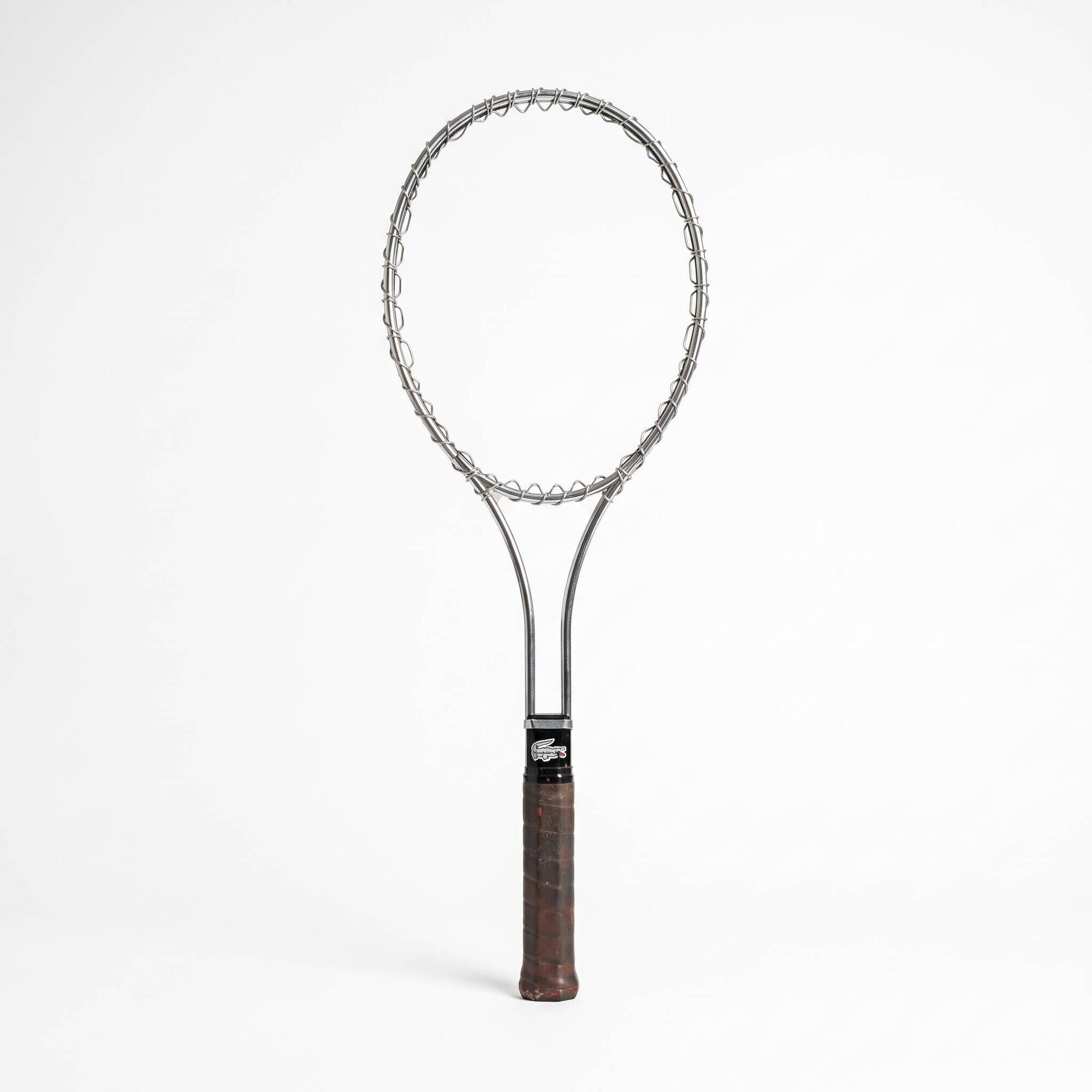 Vintage metal tennis racket by Lacoste, French design by René Lacoste.