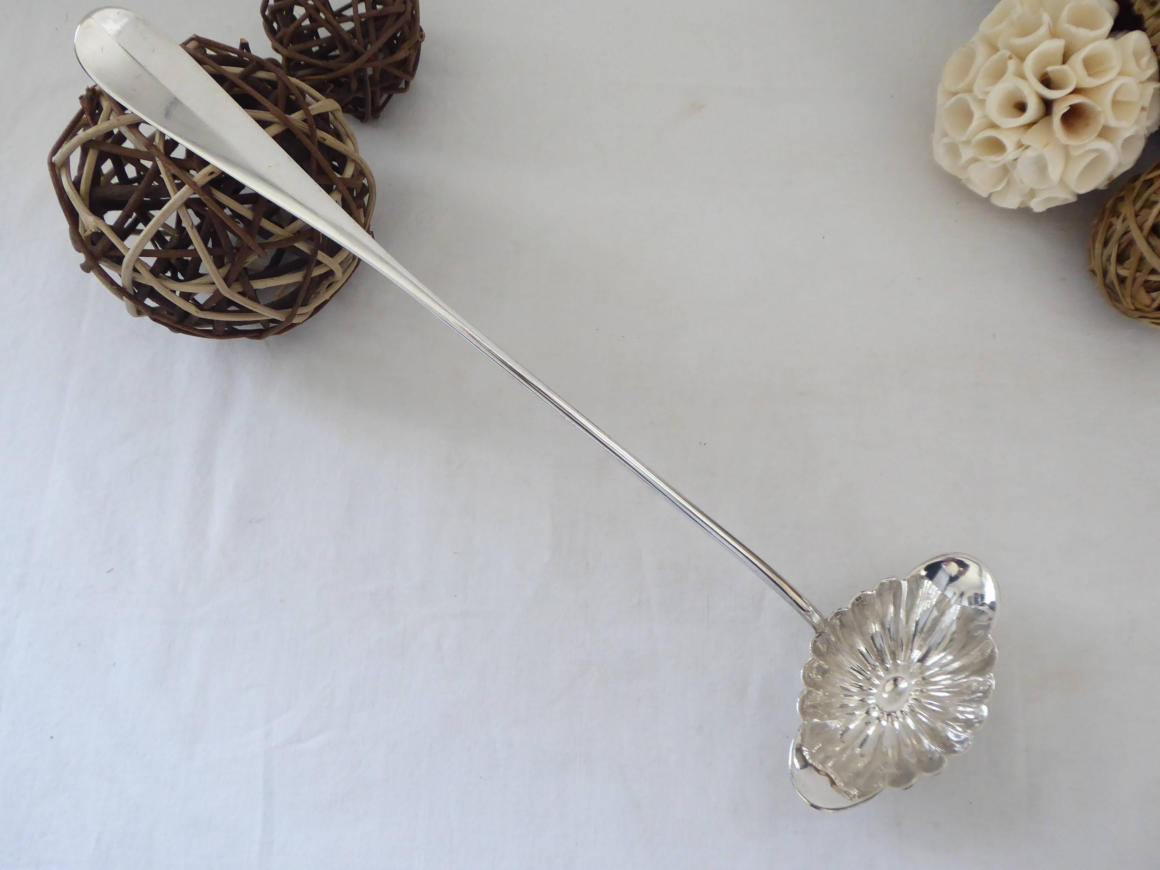 Silver metal sauce ladle