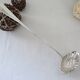 Silver metal sauce ladle