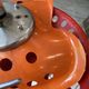 Orange tractor stool, pivoting adjustable mower, Fermigier Mirima 70.