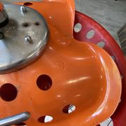 Orange tractor stool, pivoting adjustable mower, Fermigier Mirima 70.