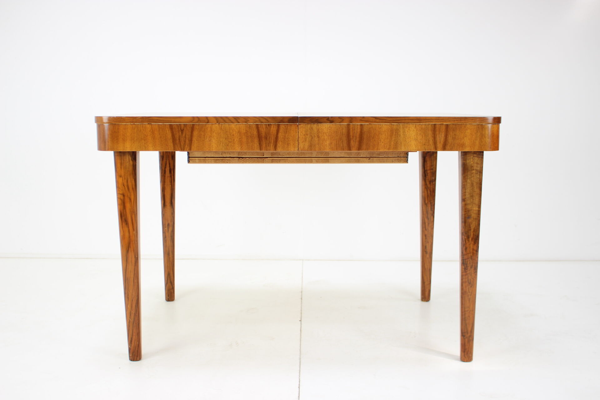 Extendable dining table designed by Jindřich Halabala for UP Závody, 1957.