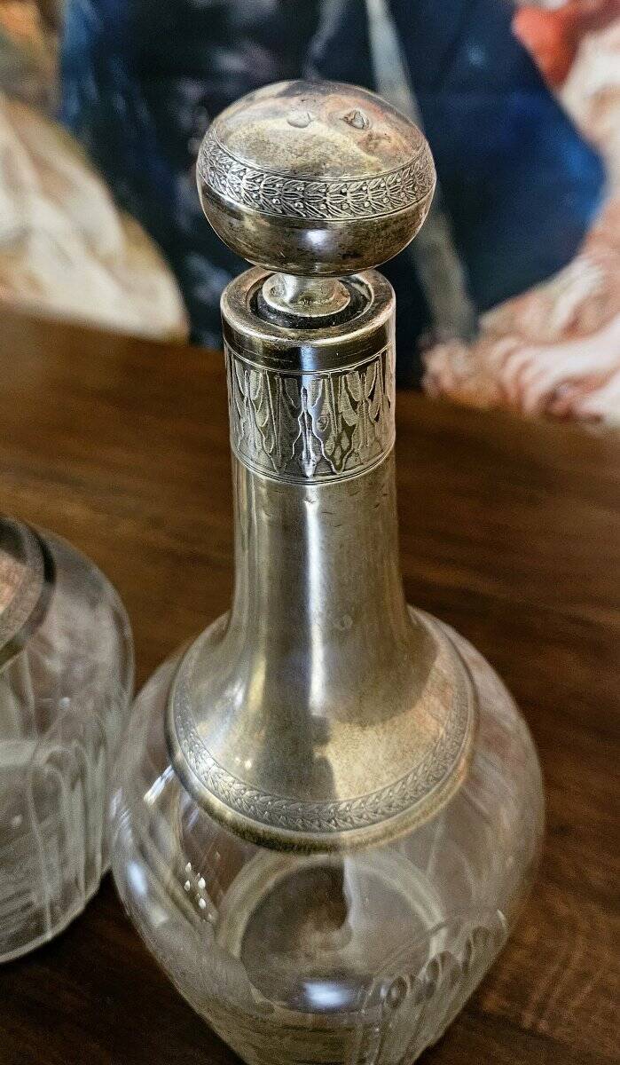 Pair of antique crystal and solid silver decanters.