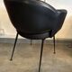 1960 armchair in black faux leather in the style of Eero Saarinen, Knoll.