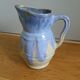 Pastel blue pitcher signed