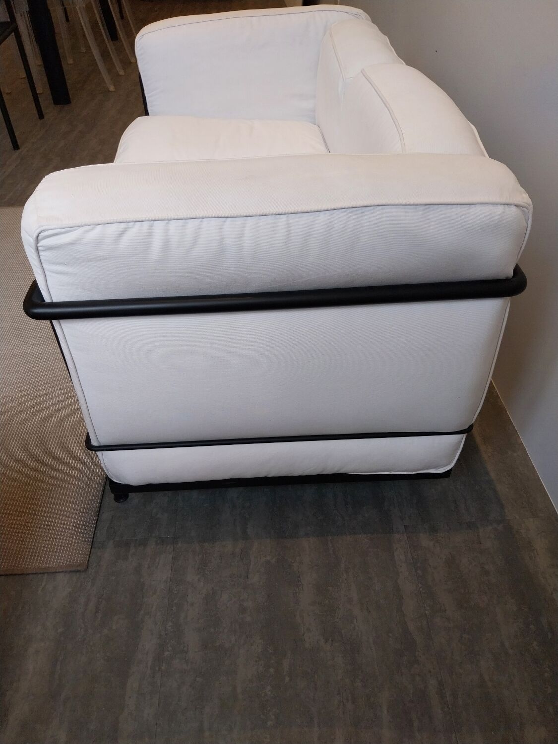 A sofa and two LC2 Cassina armchairs