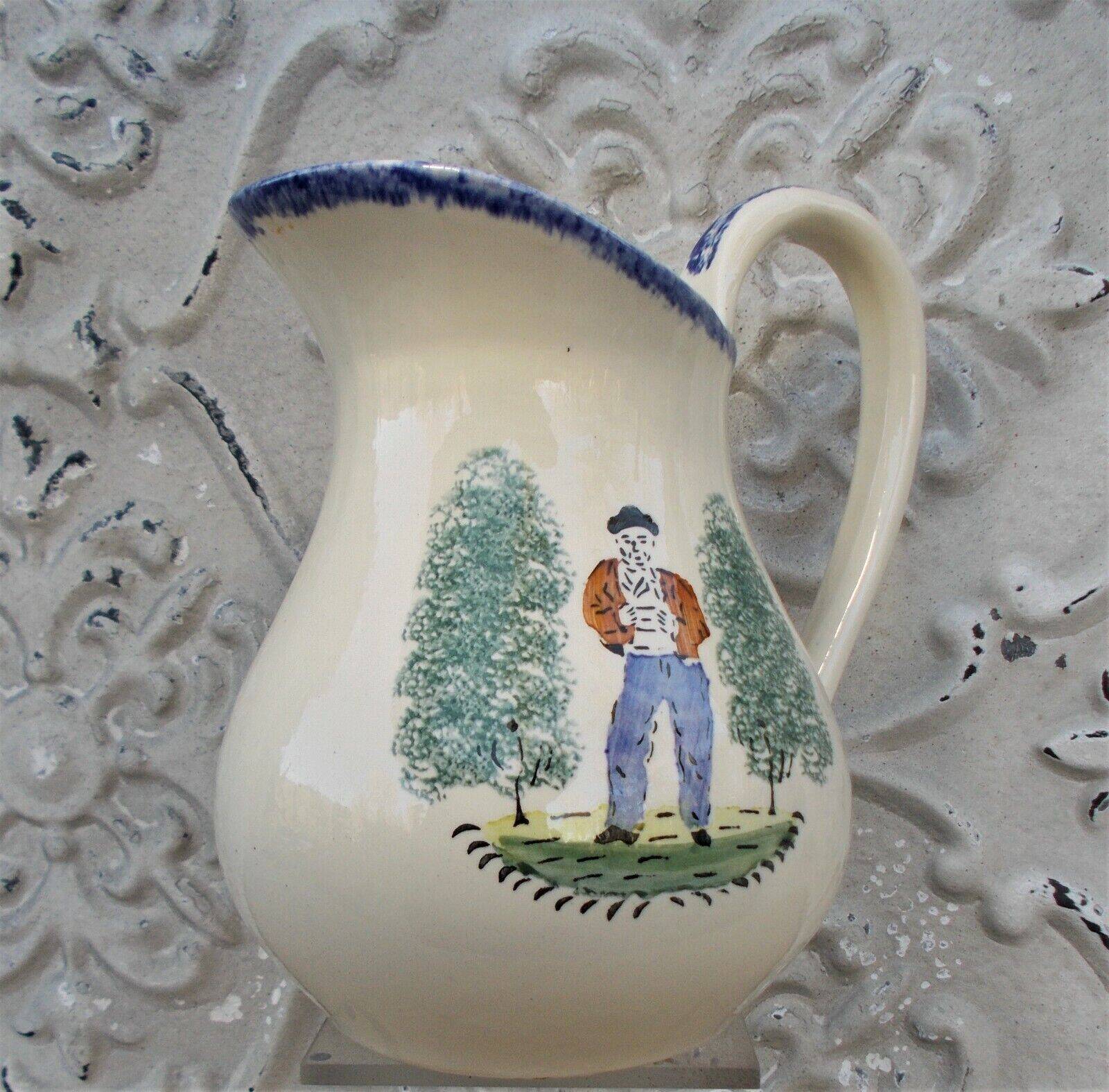 1 St Clément earthenware pouring jug decorated with characters