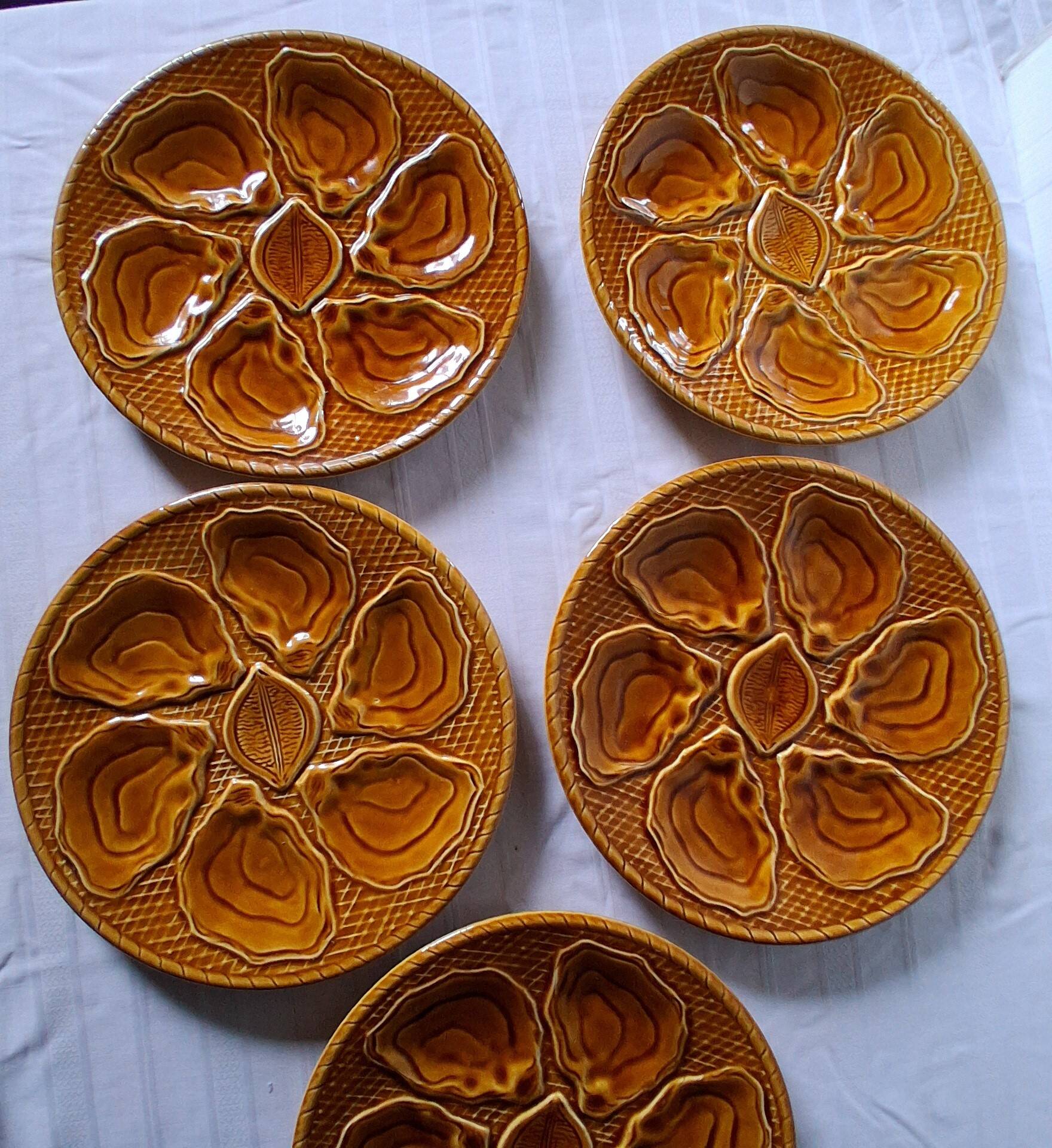 5 oyster or brown shell plates in good condition