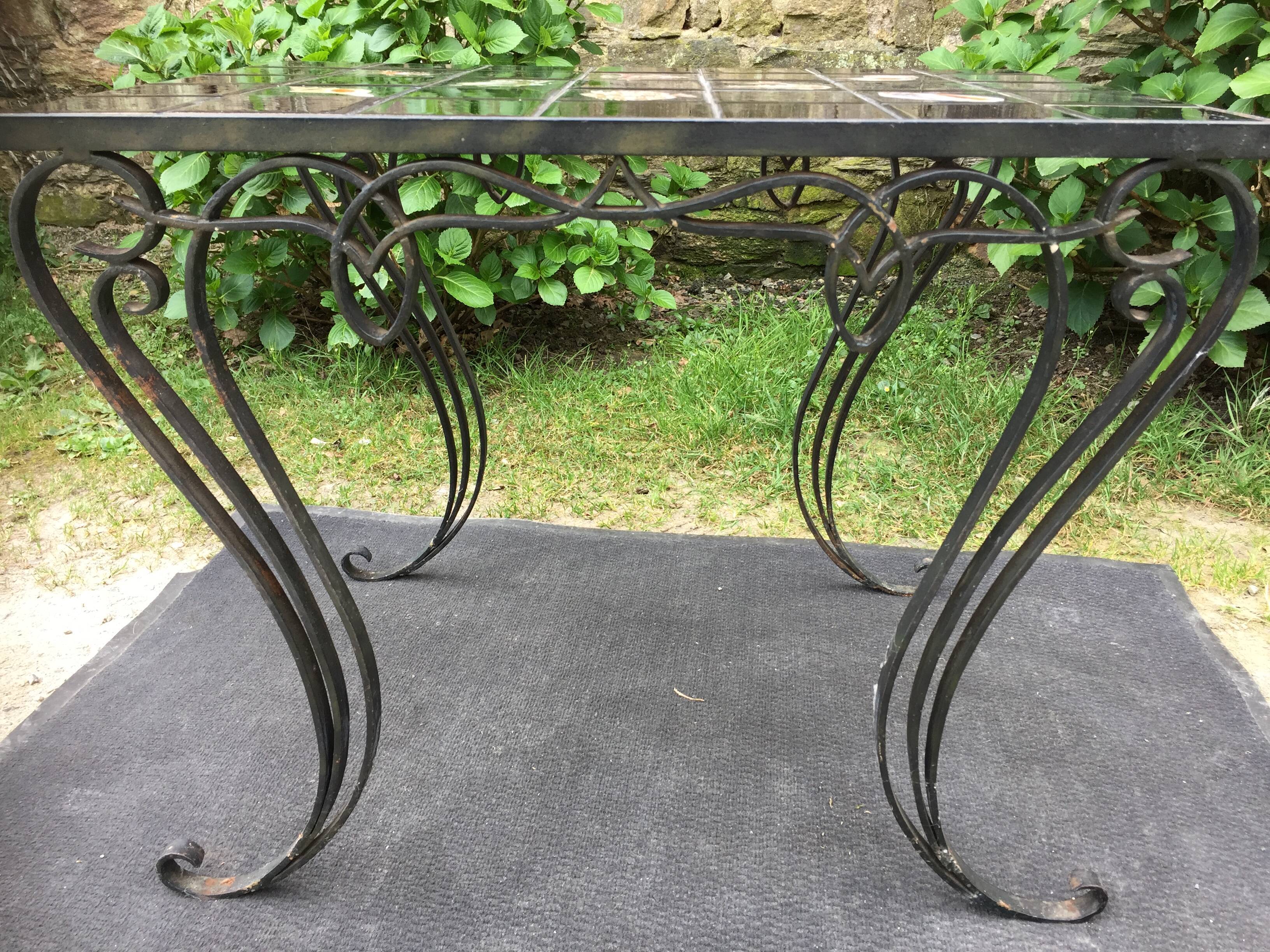 Vintage ceramic coffee table by Guy Trévoux with wrought iron base.