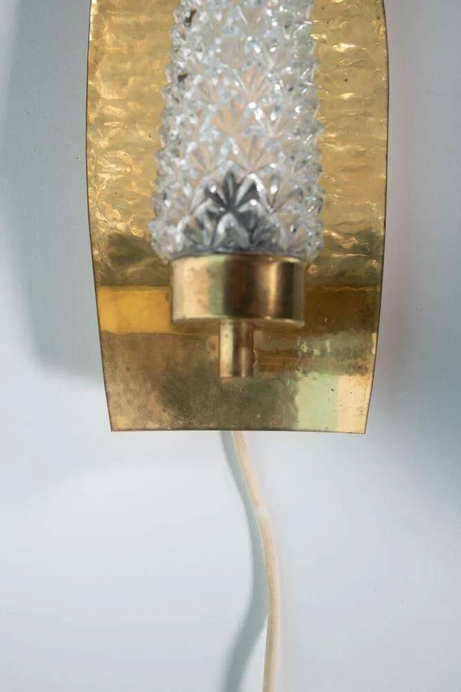 Vintage glass wall sconce from the 1960s in brass, mid-century light.