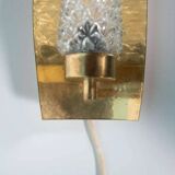 Vintage glass wall sconce from the 1960s in brass, mid-century light.