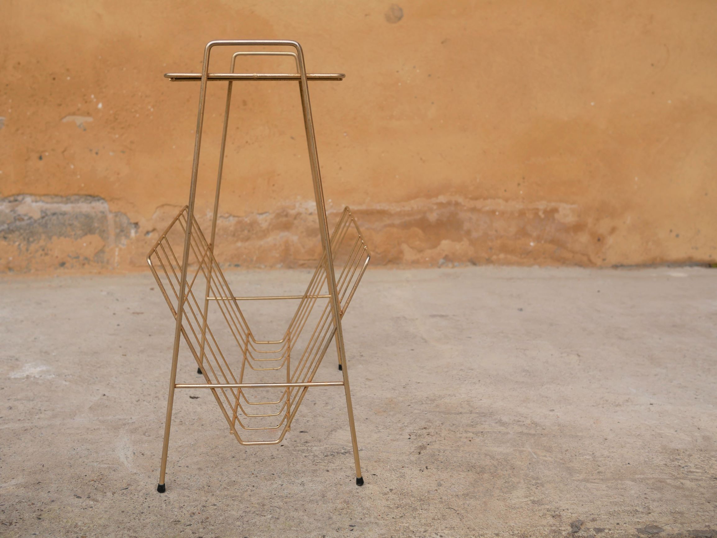Vintage gold metal magazine rack