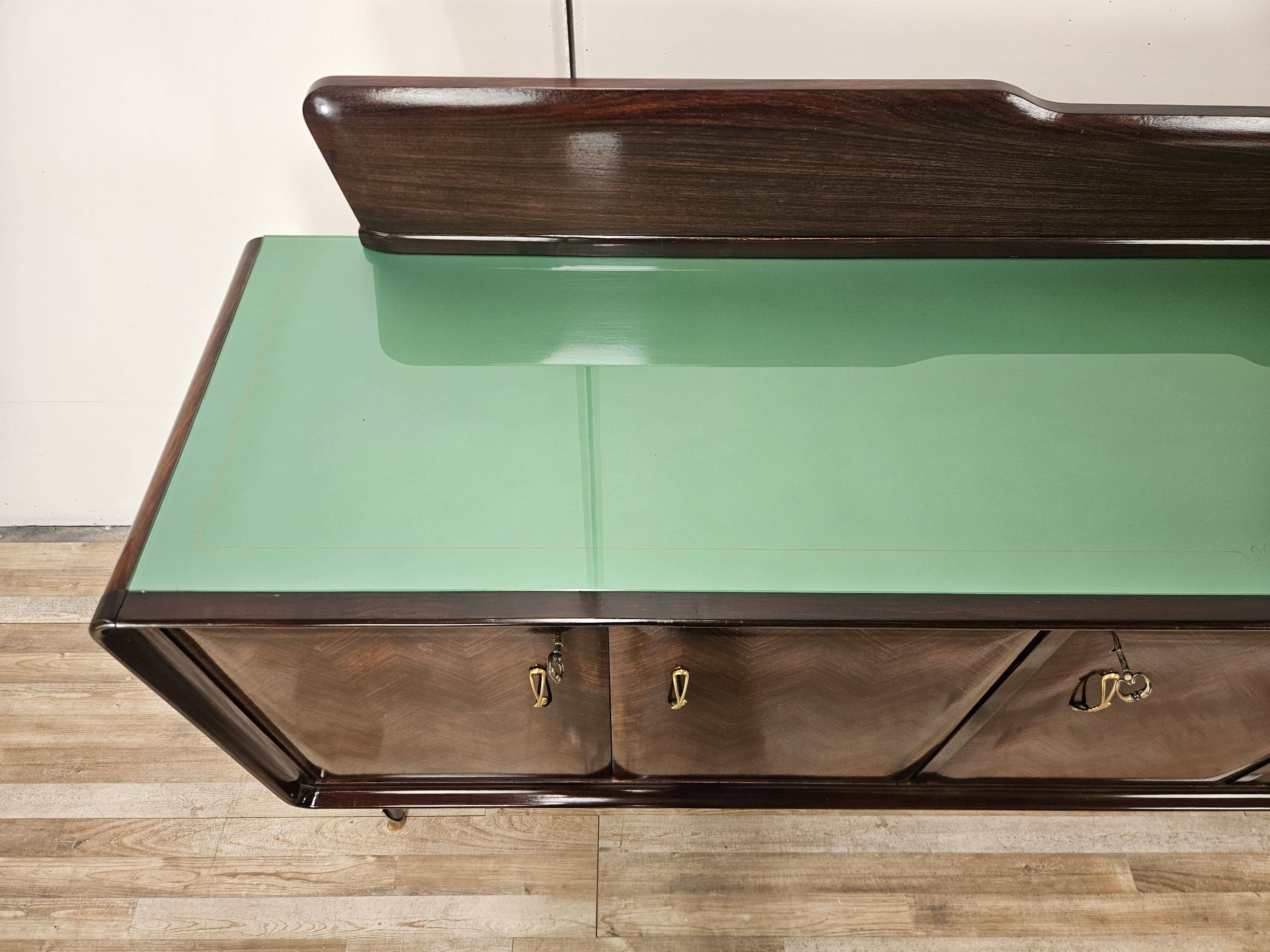 Mahogany sideboard with a glass top, 1960