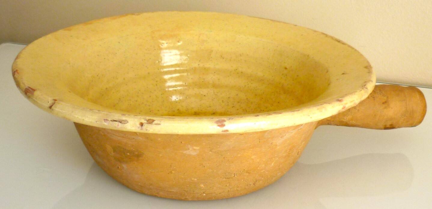 Frying pan, old caquelon, yellow glazed earthenware from the south of France.