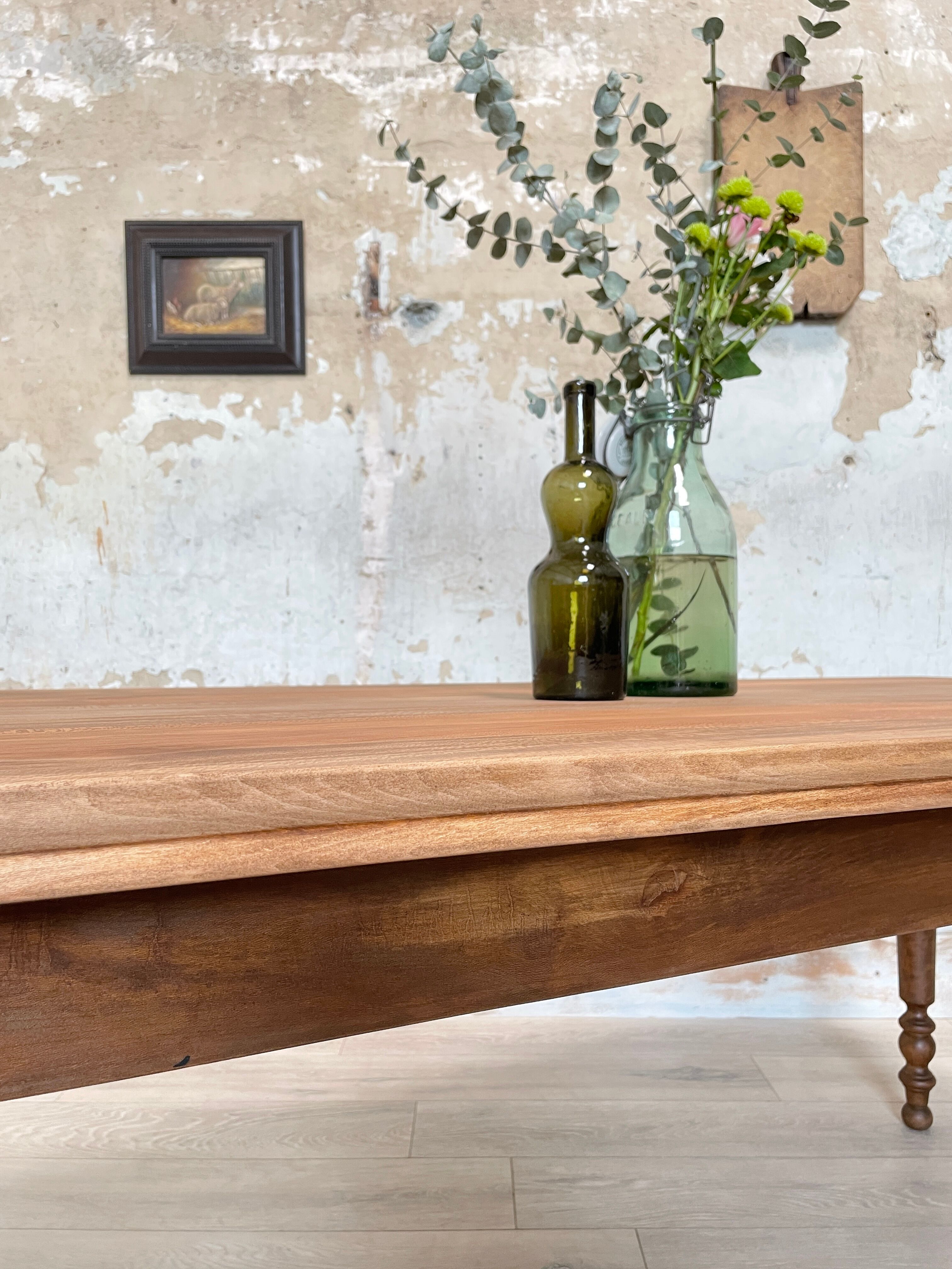 Vintage farmhouse table with turned legs.