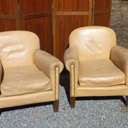 Pair of 1930s club armchairs in ivory leather.