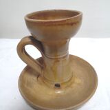 Candlestick in sandstone, cellar rat