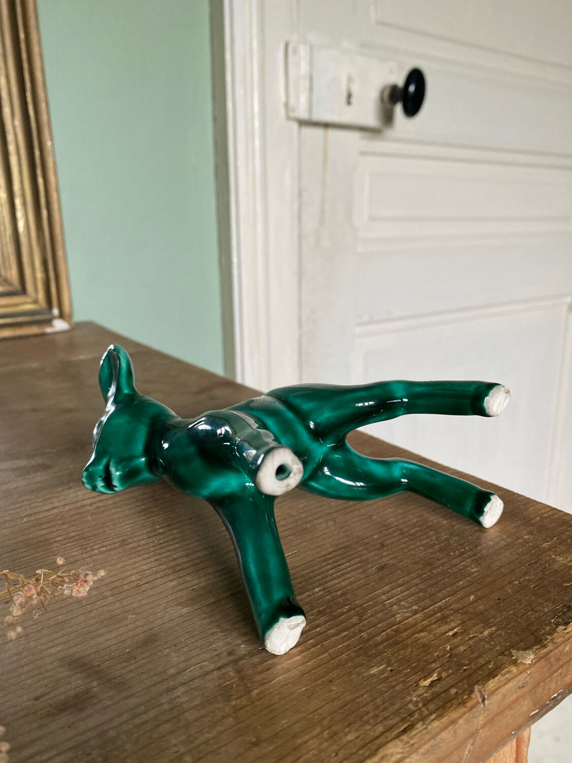 Art Nouveau green glazed ceramic fawn