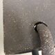 Graphical black stoneware ceramic wall light with handmade ring.
