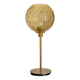Table lamp with an antique vintage gold globe, mounted on a gold base