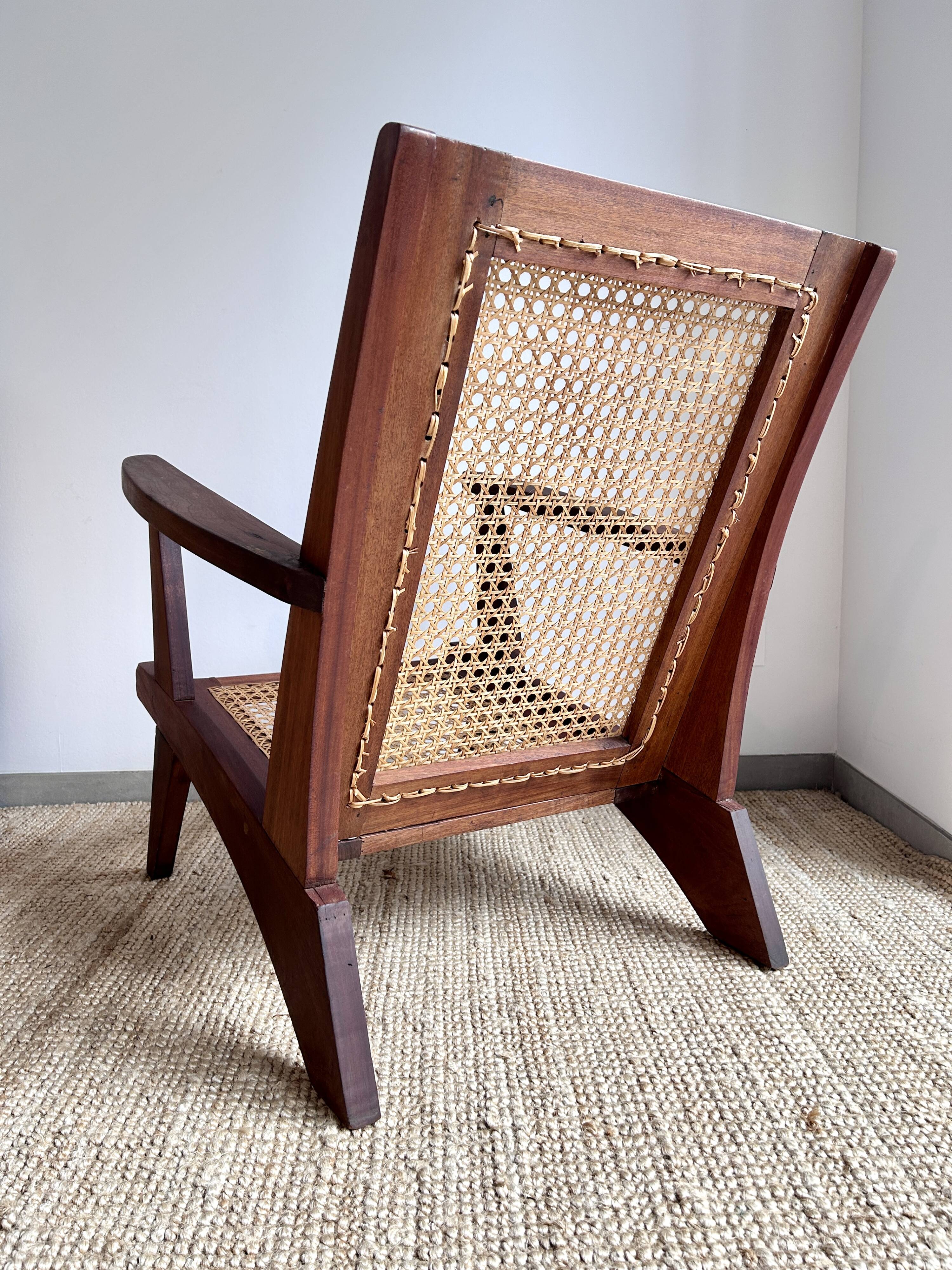 Reconstruction armchair in teak and caning