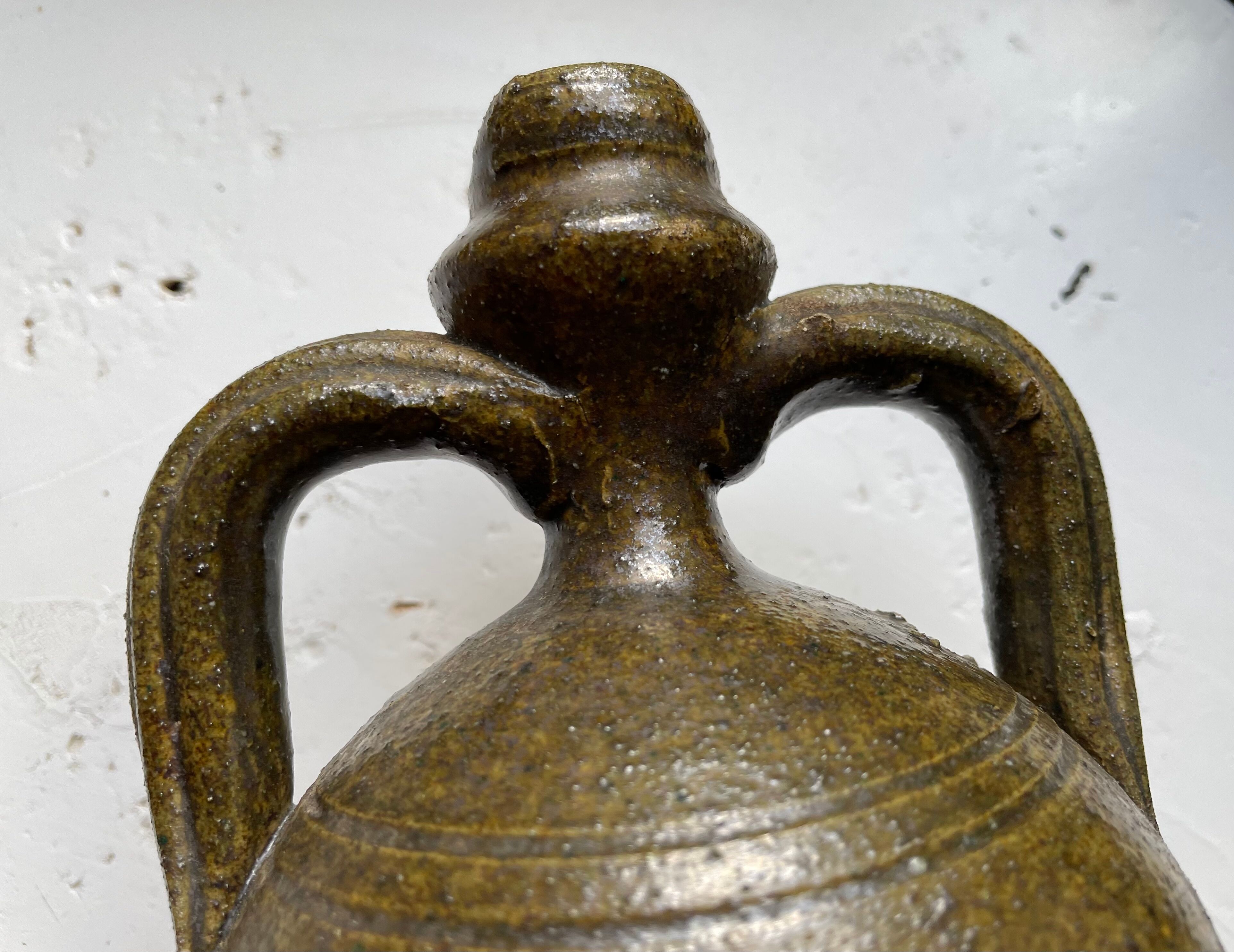 Persimmon glazed terracotta oil jar