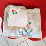 Large white map with colored flower insertion and embroidery.
