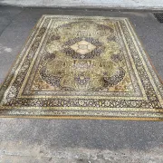 Large Persian wool rug 250x350 cm in gold and navy blue.