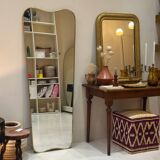 Long trapezoidal mirror in curved gilded brass, art deco modernist