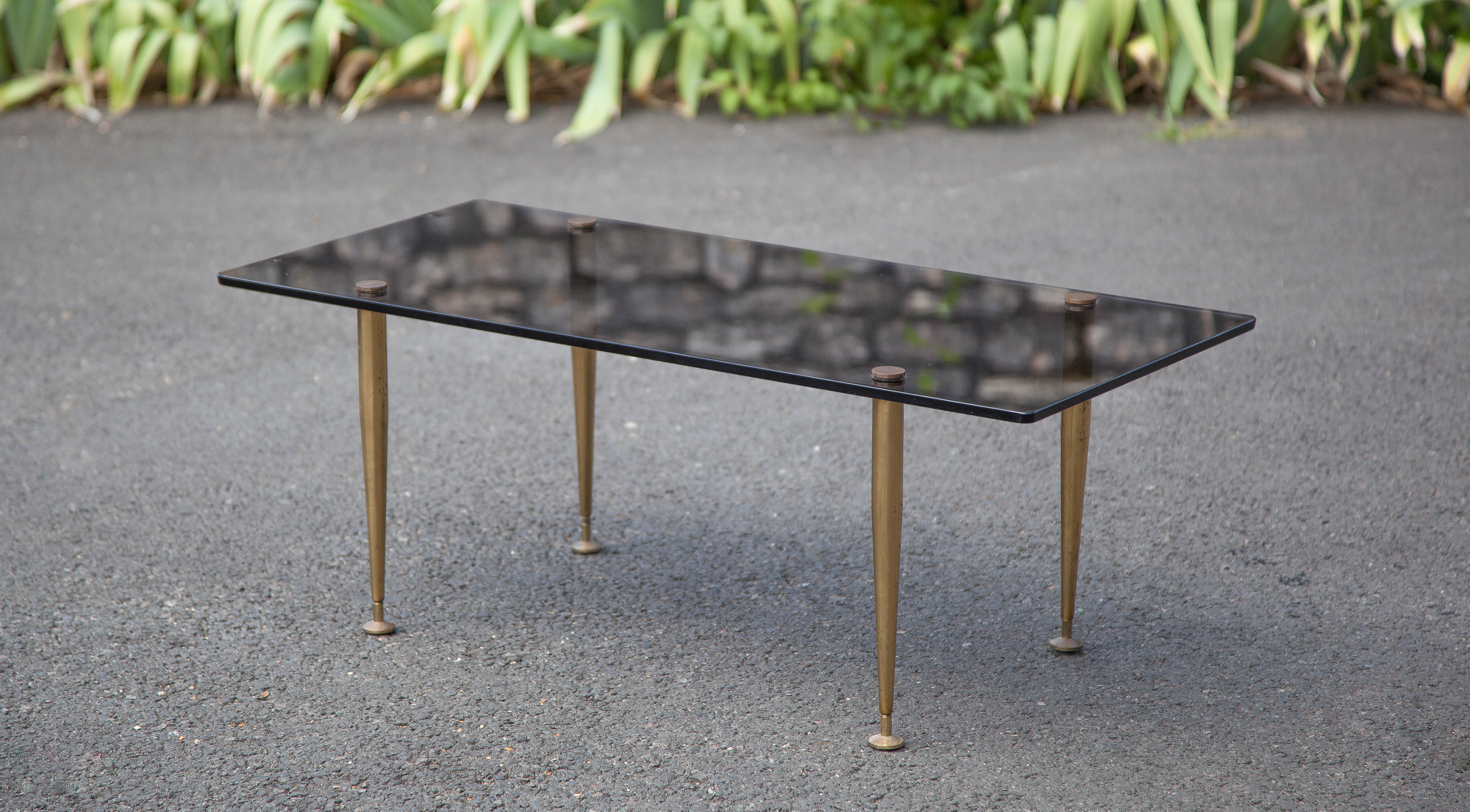 Smoked glass coffee table with adjustable brass legs, end of sofa, 70s table