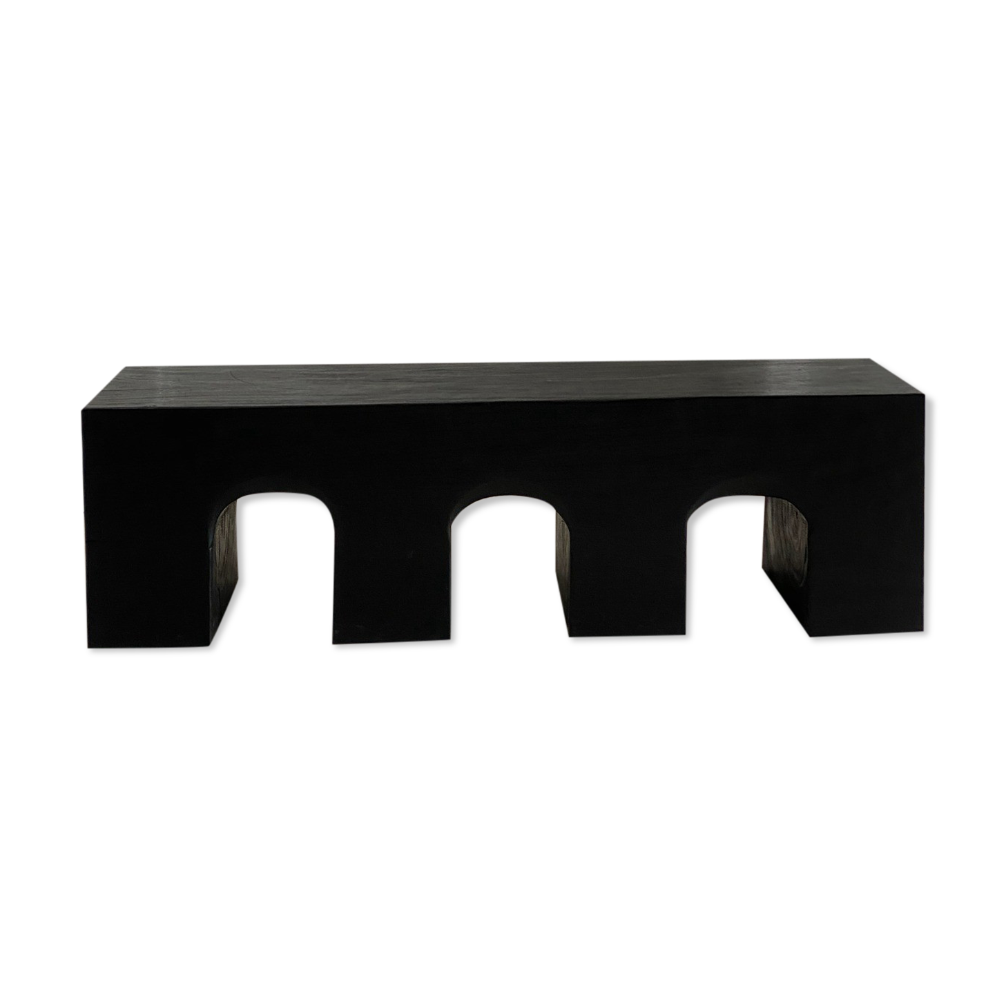 Black solid monoxyl wood bench carved into 3 arches