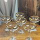Champagne coupes or cocktail glasses with gilding
