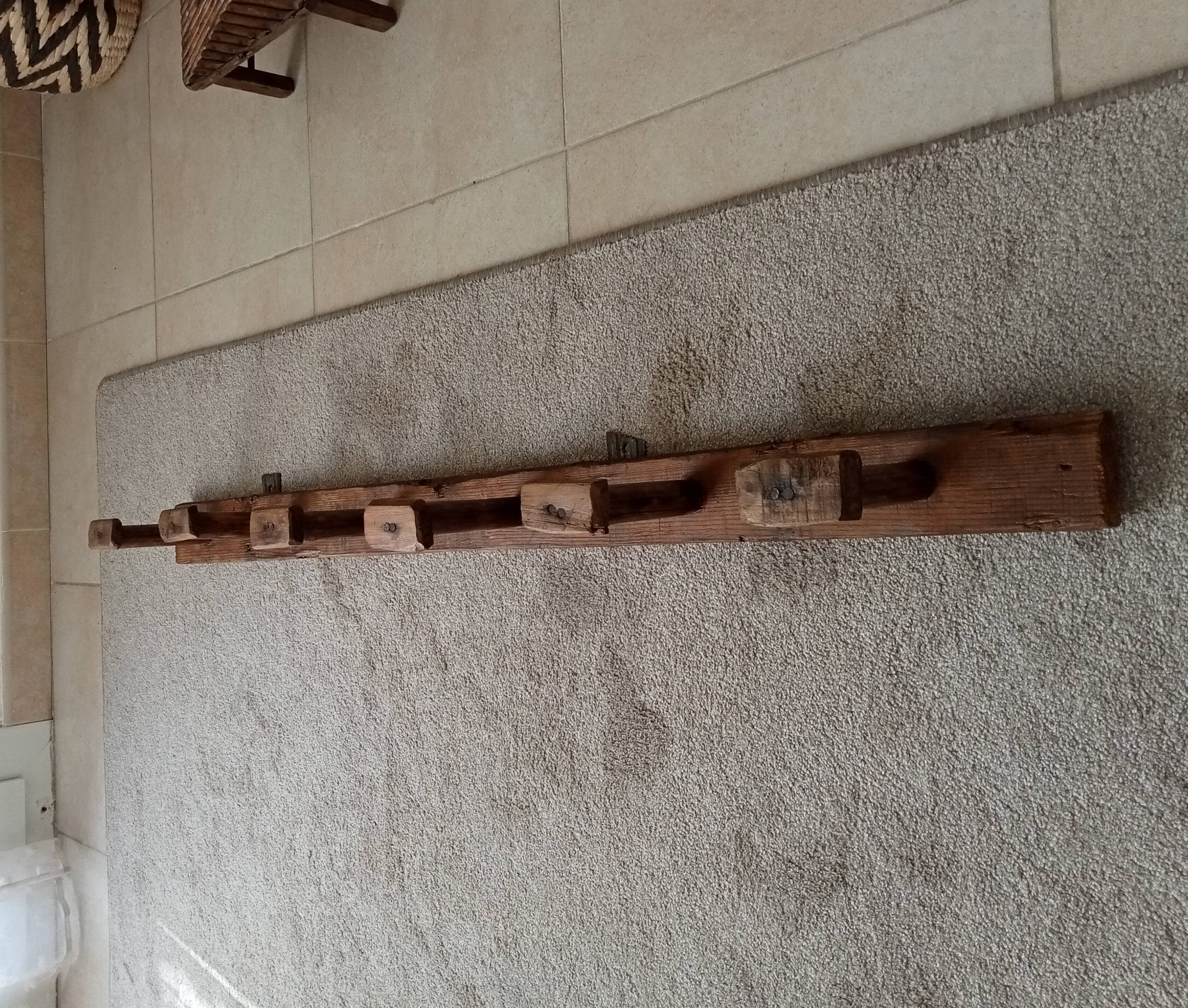 Old wall-mounted coat rack from a stable, folk art.