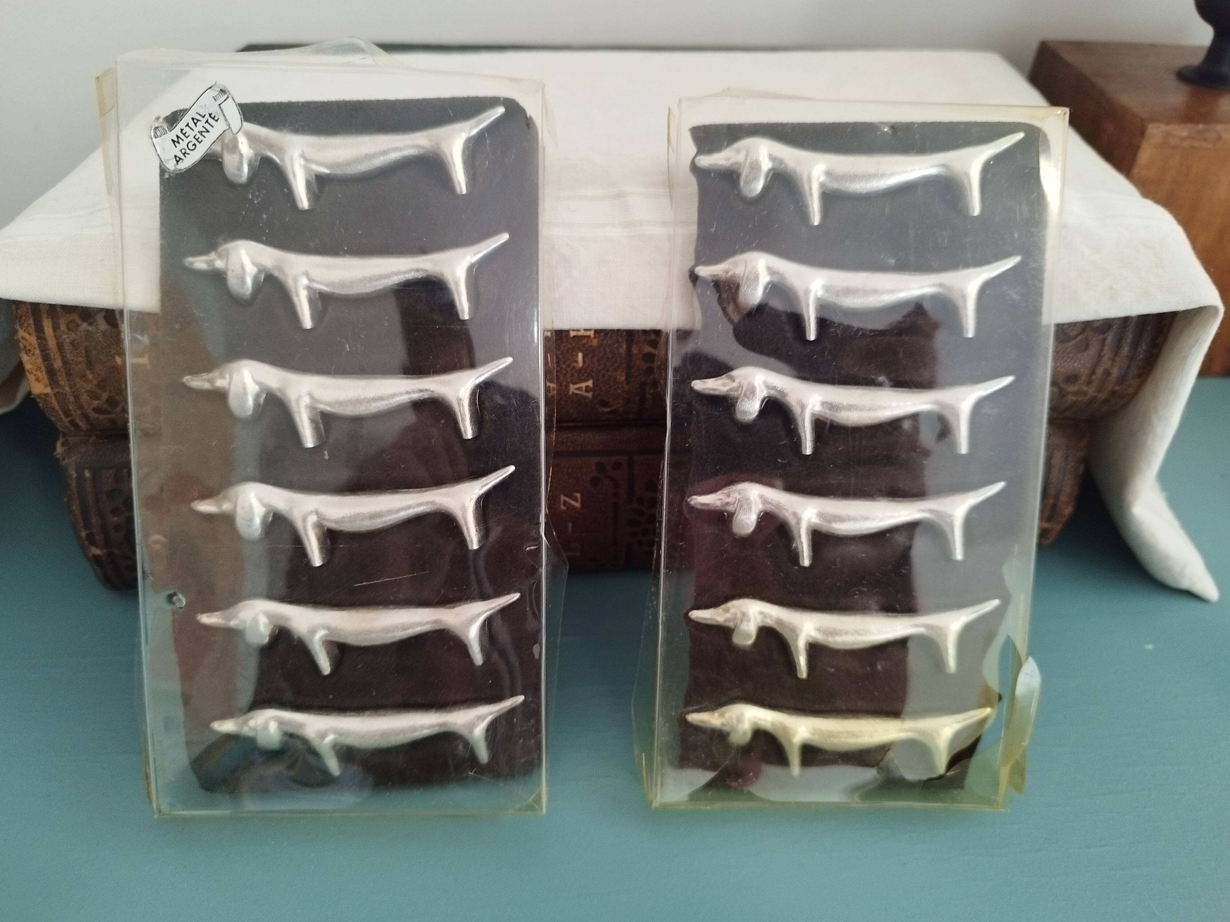 Silver metal knife holders with Dachshund dogs