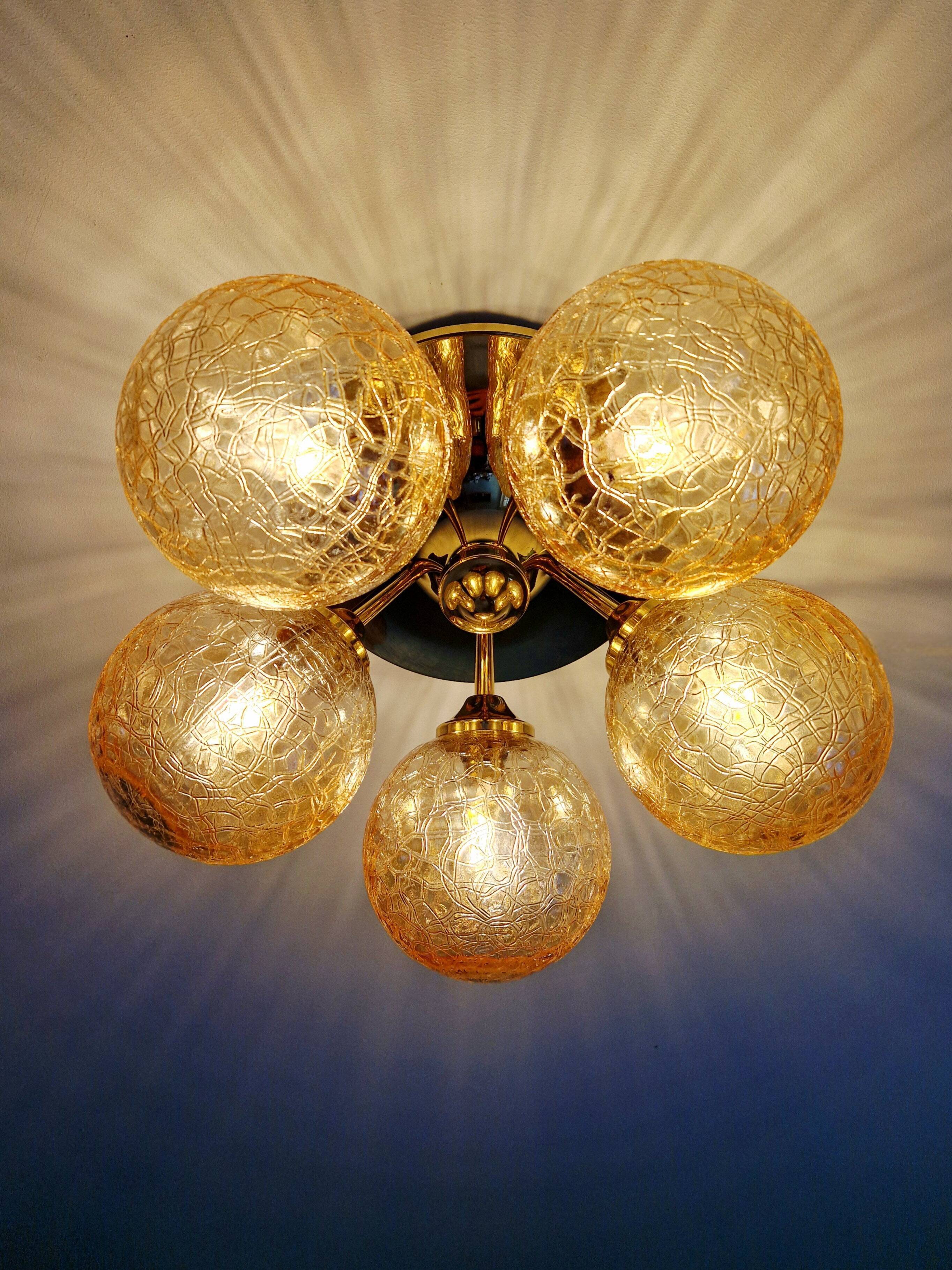 Large designer ceiling light in brass and amber crackled glass, 1970s.