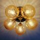 Large designer ceiling light in brass and amber crackled glass, 1970s.