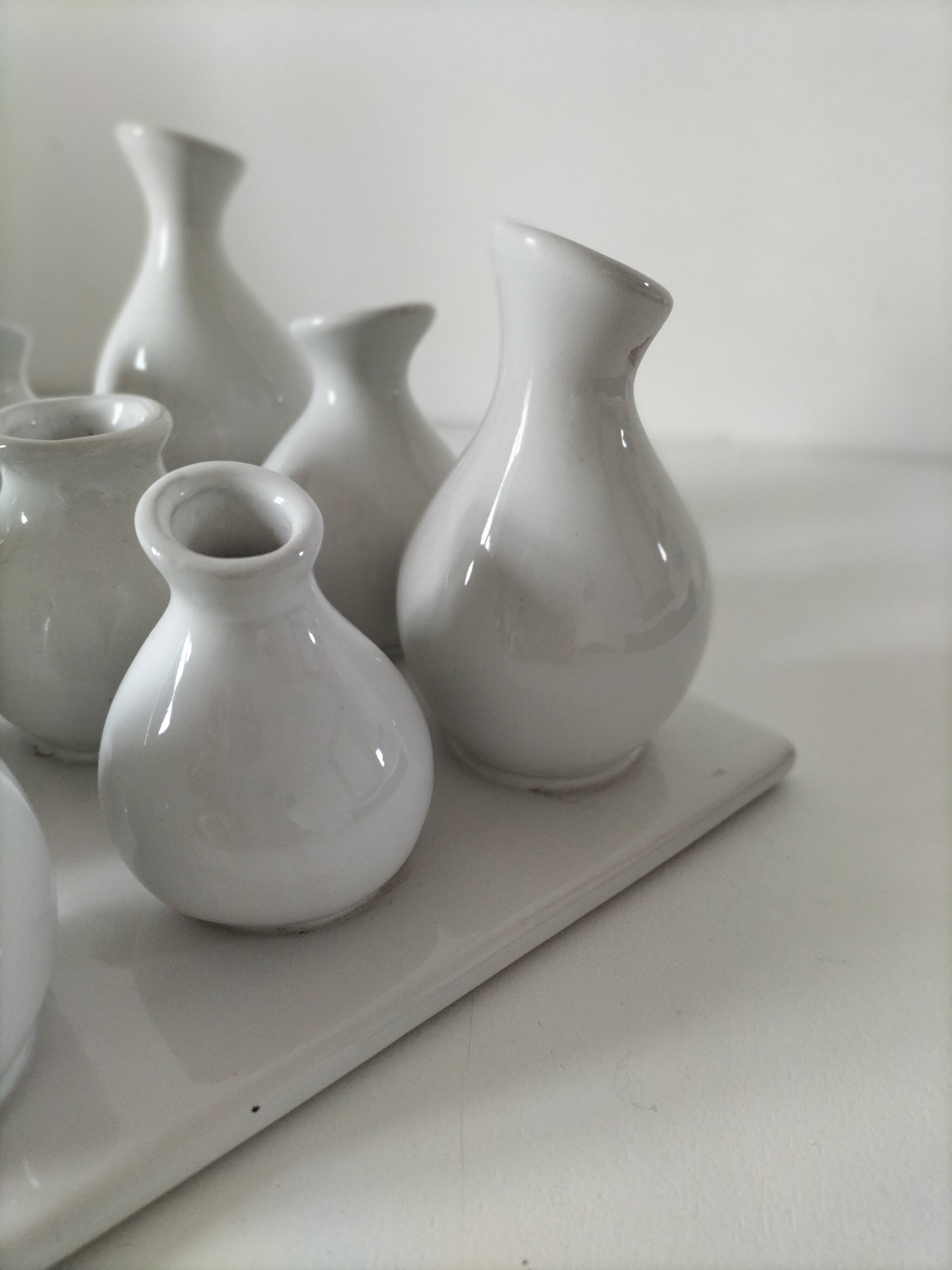 Multiple vintage white soliflore – centrepiece with 9 ceramic vases