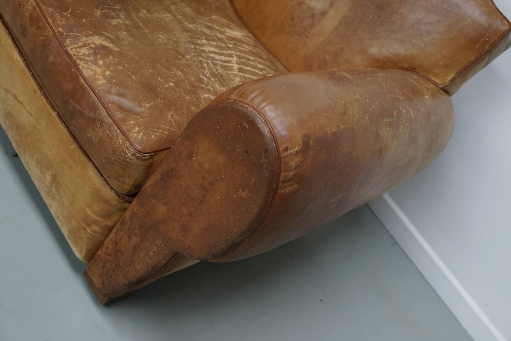 Pair of French club chairs with moustache back in cognac leather, 1940s