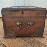 Old Indian wooden wedding chest decorated with chiseled brass plaque. India late 19th/early 20th