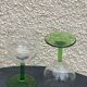 5 transparent glass glasses and green glass vase go
