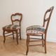 Pair of antique Louis XV style chairs in wood and floral fabric.