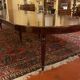 Extensible dining table from the Louis XVI period in mahogany with a banded top.