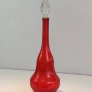 Large designer bottle in red glass