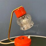 Small orange desk lamp with clear crystal glass shade