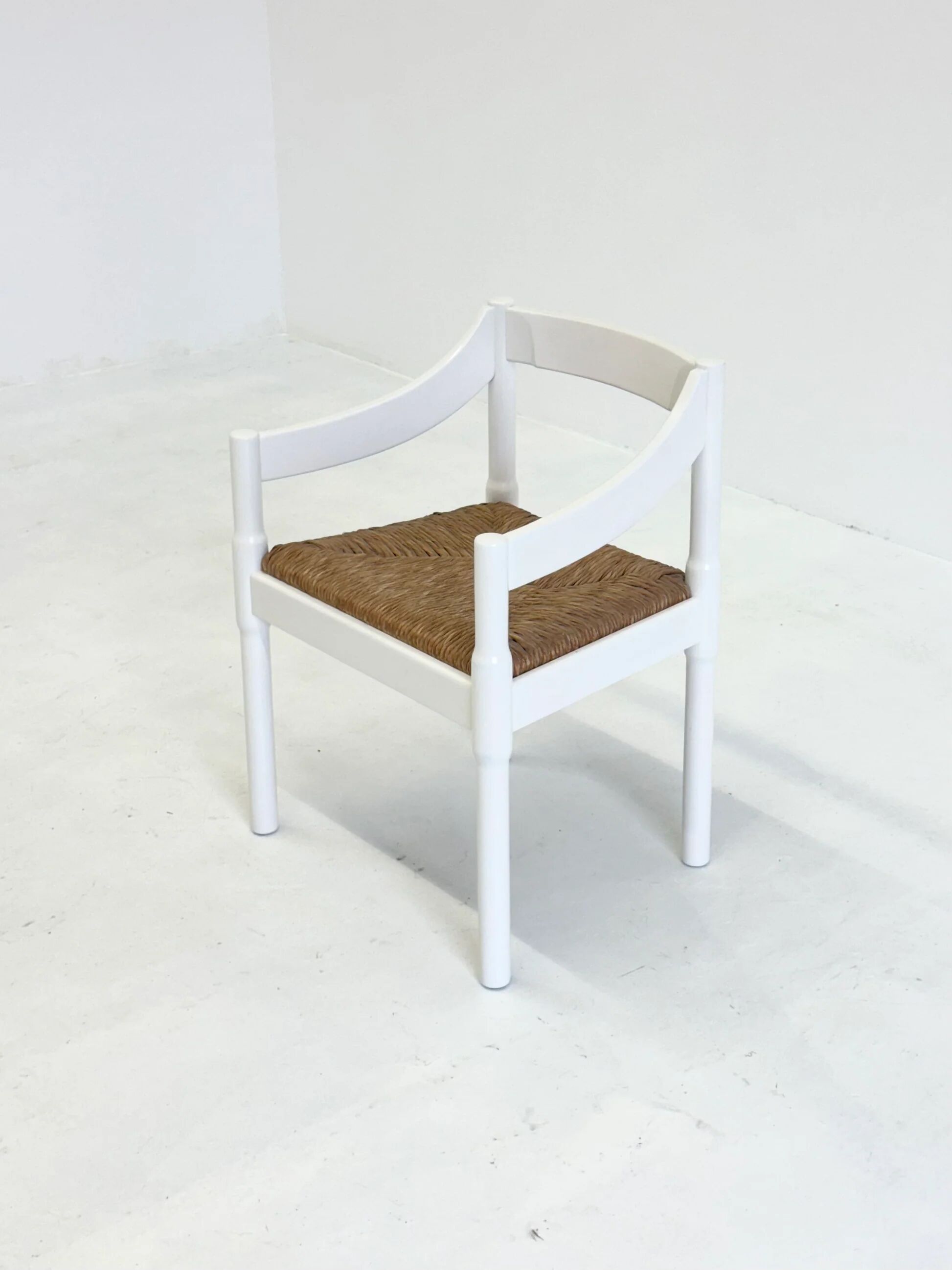 Set of two Carimate chairs by Vico Magistretti in white